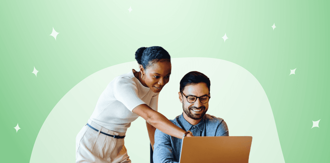woman pointing at peer's computer